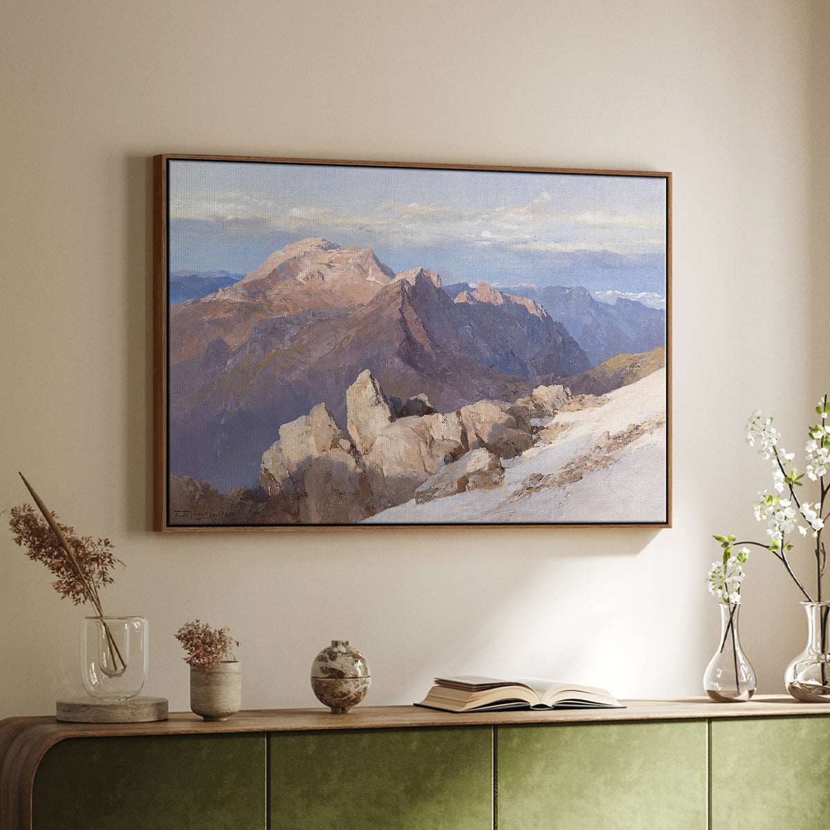 Walnut floater framed canvas of Hoher Göll from Watzmann-Hocheck, 1919 by Edward Theodore Compton, featuring an alpine panorama showing layered peaks and valleys above a sideboard in a softly lit hallway.