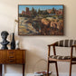 Palatine in Rome, c. 1921 by Edward Theodore Compton as a walnut floater framed canvas featuring a cityscape with classical ruins and surrounding terrain, styled above a mid-century console in a contemporary living area.