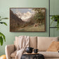 Walnut floater framed canvas featuring a realistic depiction of remote mountain environment, displayed above a sofa in a modern living room.