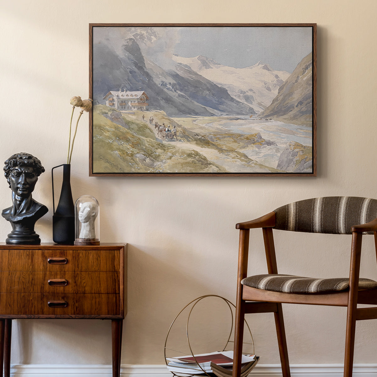 Shepherds (Pasterze), c. 1921 by Edward Theodore Compton as a walnut floater framed canvas featuring a rural alpine setting with shepherds and open terrain, styled above a mid-century console in a contemporary living area.