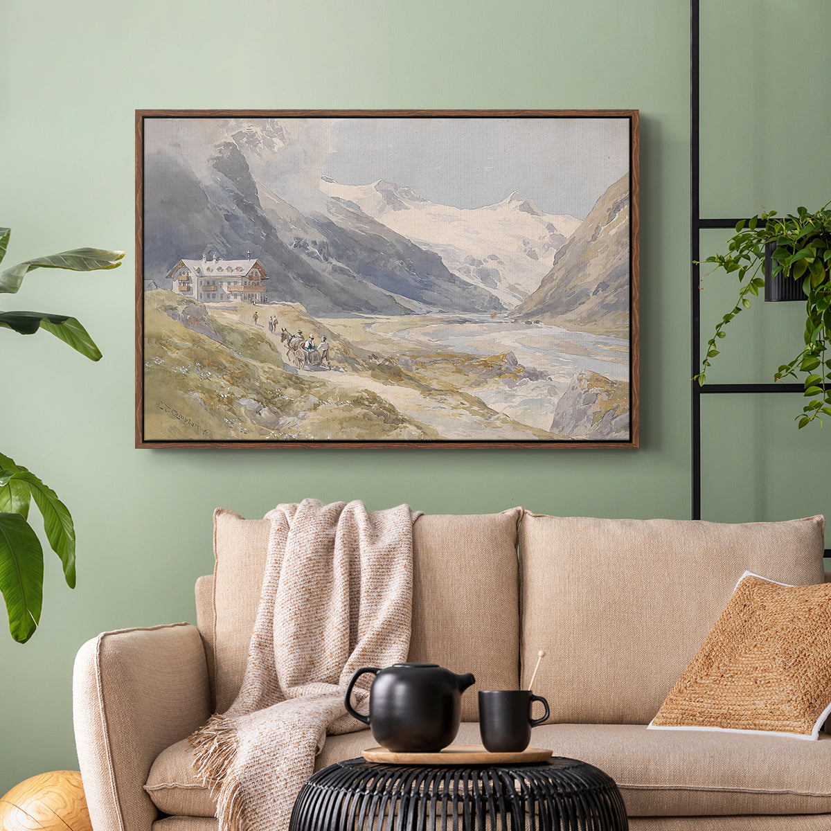 Walnut floater framed canvas featuring a natural landscape with human presence among mountains, displayed above a sofa in a modern living room.