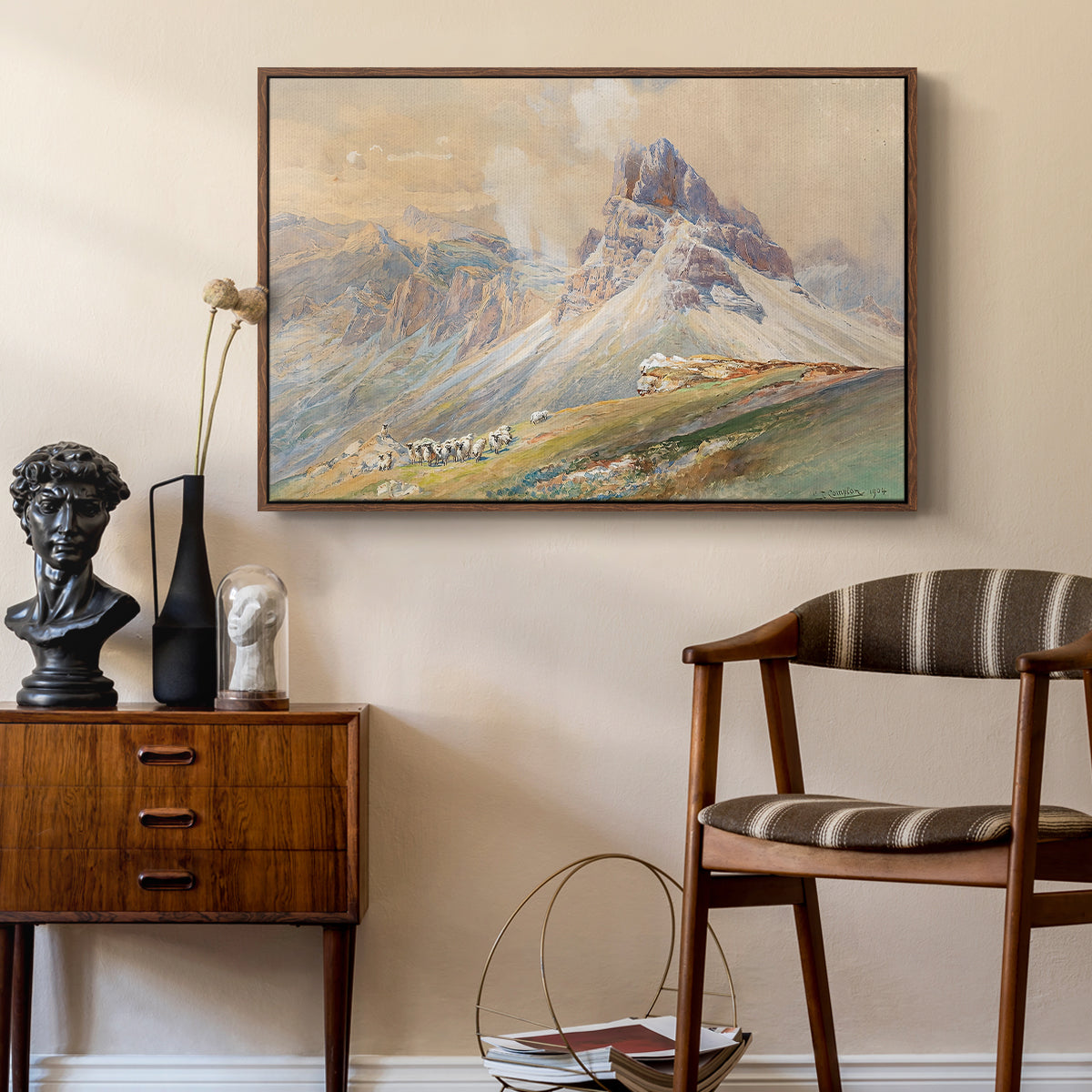 From the Dolomites, 1904 by Edward Theodore Compton as a walnut floater framed canvas featuring an expansive landscape featuring iconic Dolomite peaks, styled above a mid-century console in a contemporary living area.