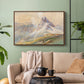 Walnut floater framed canvas featuring a realistic mountain view with strong geological forms, displayed above a sofa in a modern living room.