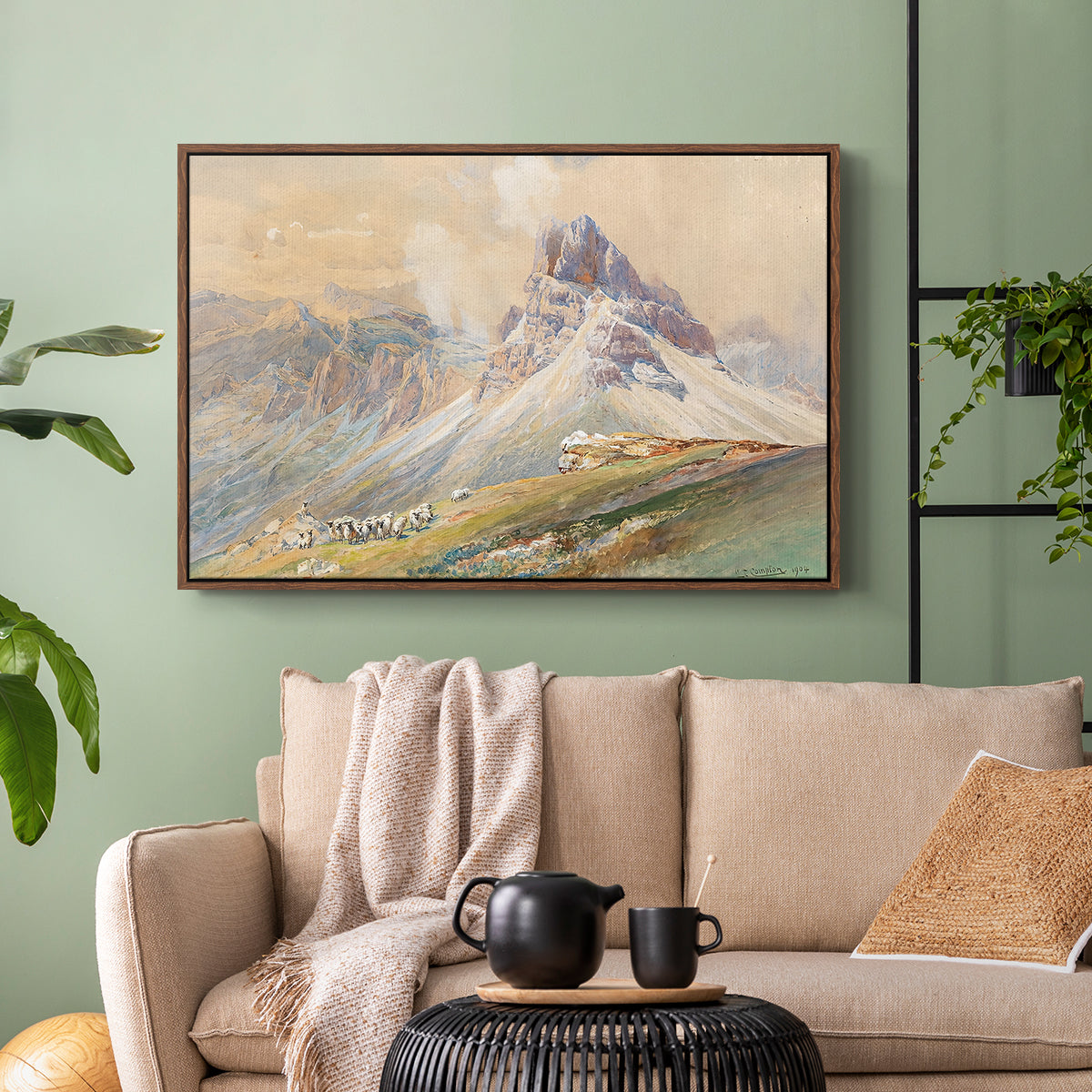 Walnut floater framed canvas featuring a realistic mountain view with strong geological forms, displayed above a sofa in a modern living room.