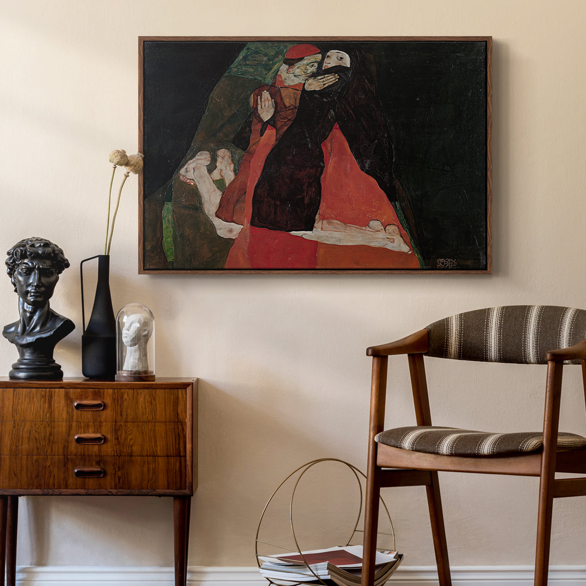Cardinal and Nun (Caress), 1912 by Egon Schiele as a walnut floater framed canvas featuring an expressive painting of figures entwined with bold lines and color, styled above a mid-century console in a contemporary living area.