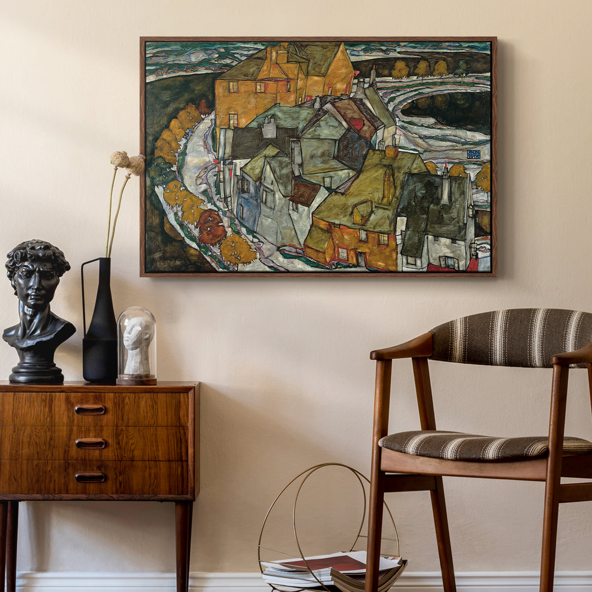 Crescent of Houses II (Island Town), 1915 by Egon Schiele as a walnut floater framed canvas featuring an expressionist depiction of island town with geometric forms, styled above a mid-century console in a contemporary living area.