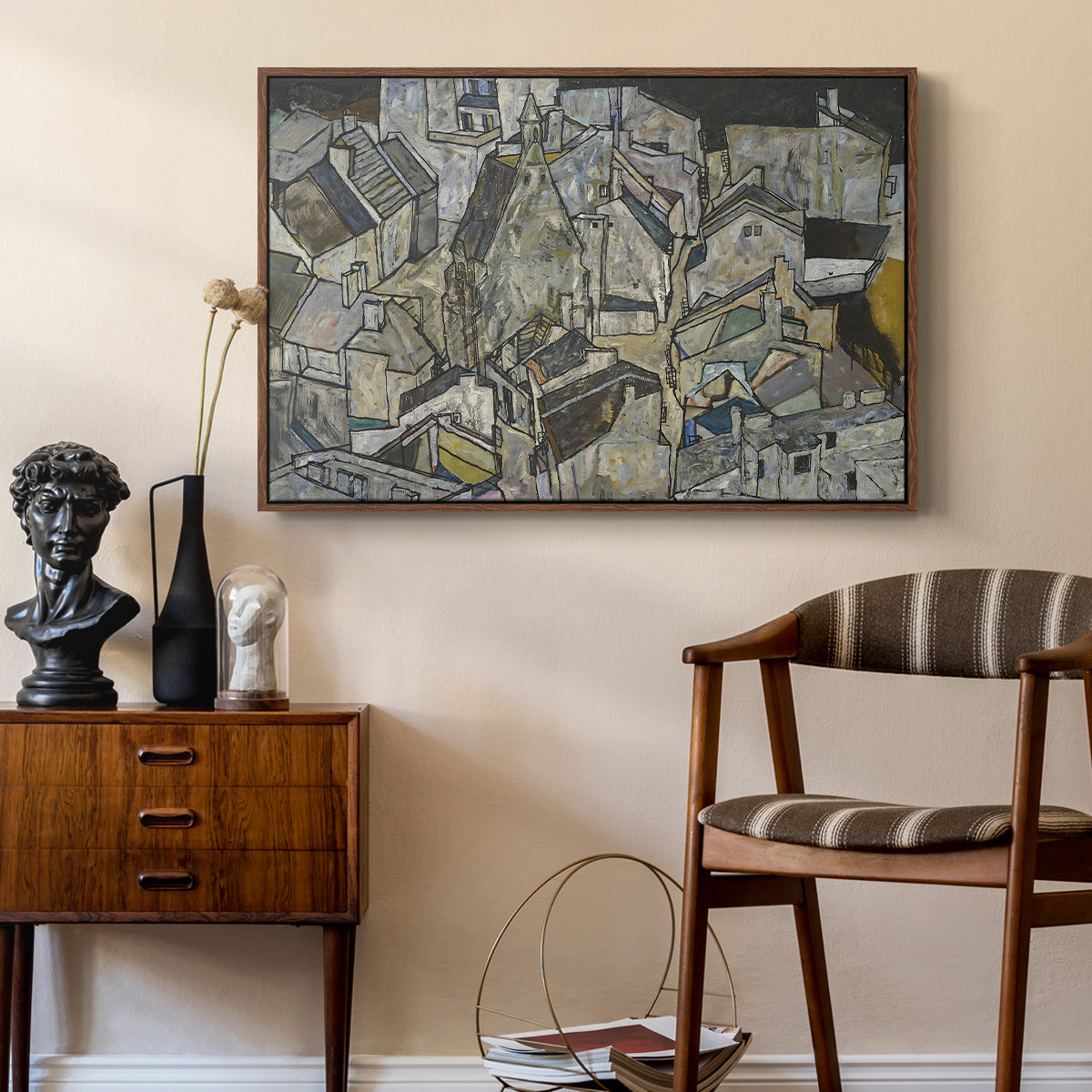Mödling II, 1918 by Egon Schiele as a walnut floater framed canvas featuring an abstracted town view with angular rooftops and fragmented forms, styled above a mid-century console in a contemporary living area.