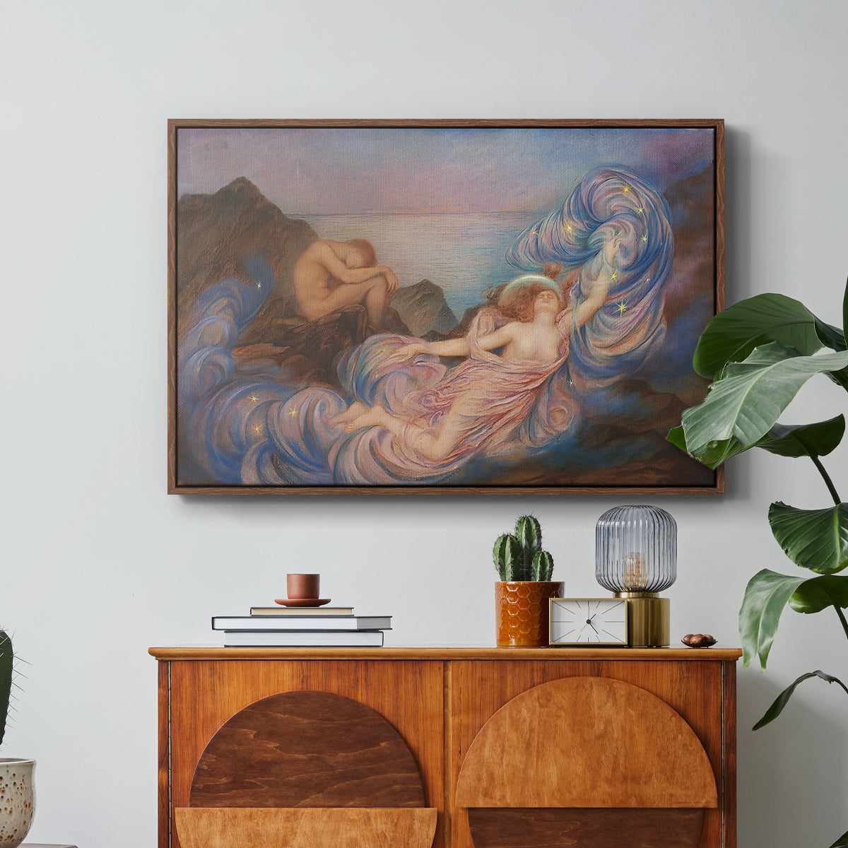 Twilight, 1914 by Evelyn De Morgan in a walnut floater framed canvas featuring a reclining female figure beneath glowing sky at twilight with soft colors, displayed above a wood console cabinet.