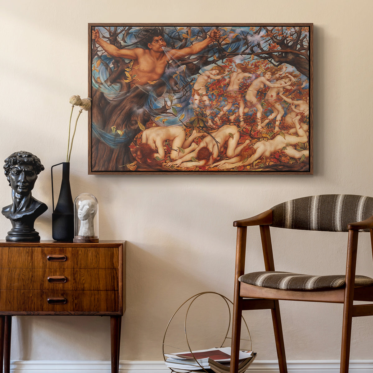 Boreas and the Fallen Leaves, c. 1910-1914 by Evelyn De Morgan as a walnut floater framed canvas featuring an energetic depiction of figures swept through air by wind, styled above a mid-century console in a contemporary living area.