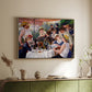 Natural wood floater framed canvas of Luncheon of the Boating Party (Le Déjeuner des canotiers), 1880-1881 by Pierre-Auguste Renoir, featuring a lively gathering of men and women eating and socializing at outdoor table above a sideboard in a softly lit hallway.