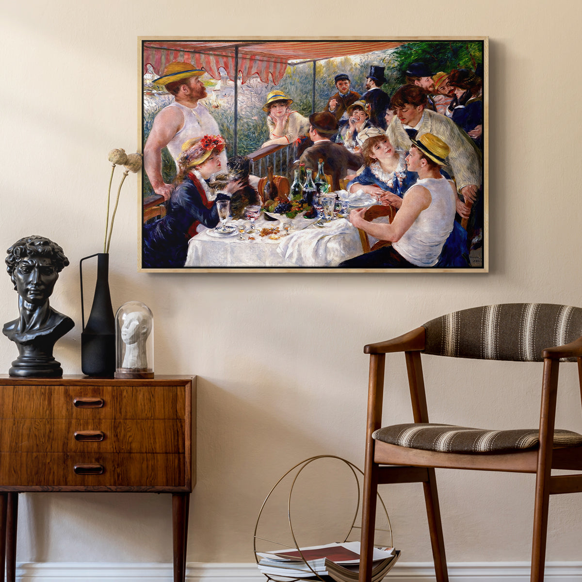 Luncheon of the Boating Party (Le Déjeuner des canotiers), 1880-1881 by Pierre-Auguste Renoir as a natural wood floater framed canvas featuring an impressionist scene of friends enjoying lunch with wine and conversation, styled above a mid-century console in a contemporary living area.