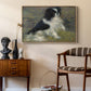Tama, the Japanese Dog, c. 1876 by Pierre-Auguste Renoir as a natural wood floater framed canvas featuring a close-up of a small dog in motion surrounded by rippling water, styled above a mid-century console in a contemporary living area.
