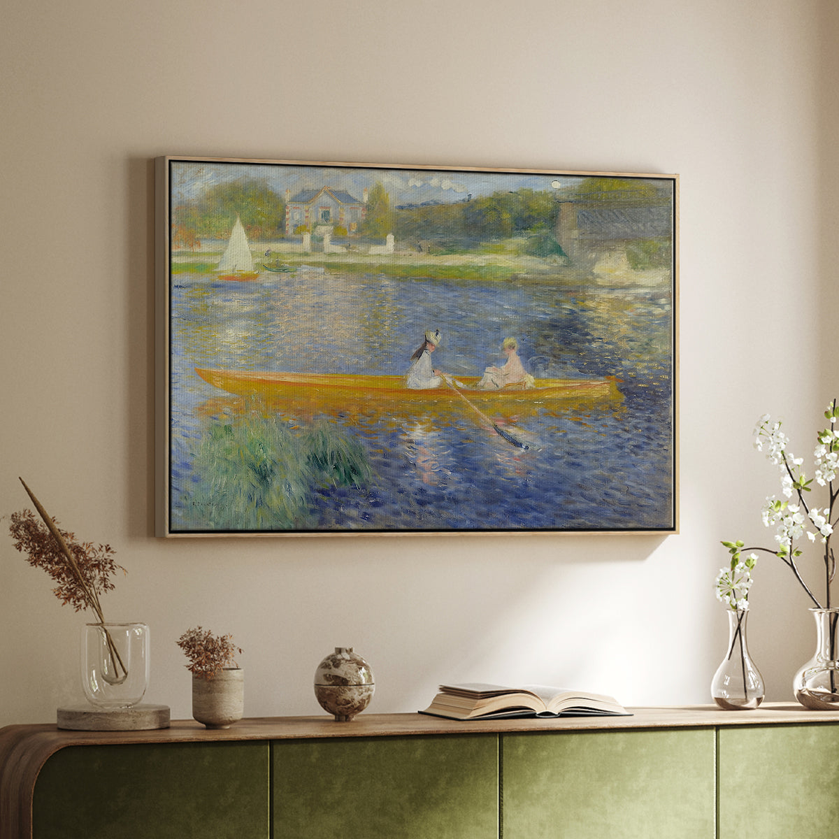 Natural wood floater framed canvas of The Skiff (La Yole), 1875 by Pierre-Auguste Renoir, featuring an impressionist boating scene with people relaxing in a narrow skiff above a sideboard in a softly lit hallway.