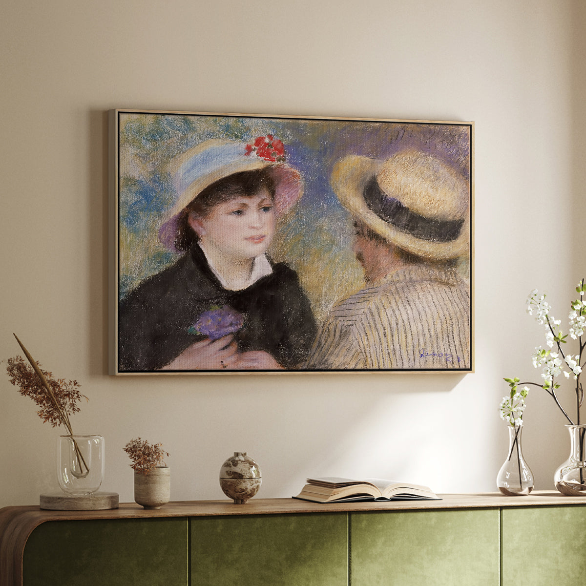 Natural wood floater framed canvas of Boating Couple (Aline Charigot and Renoir), c. 1881 by Pierre-Auguste Renoir, featuring an intimate portrait of man and woman sitting side by side in outdoor setting above a sideboard in a softly lit hallway.