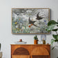 Common Swifts, 1886 by Bruno Liljefors in a natural wood floater framed canvas featuring a flock of birds in flight soaring across open sky above landscape, displayed above a wood console cabinet.