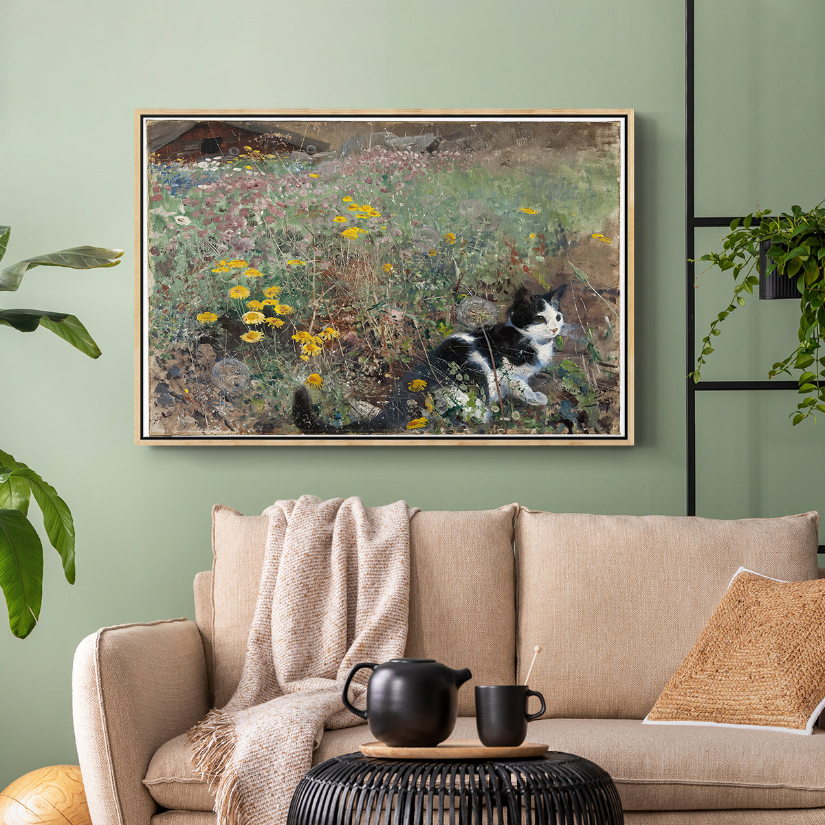 Natural wood floater framed canvas featuring a naturalistic depiction of cat in blooming countryside setting, displayed above a sofa in a modern living room.
