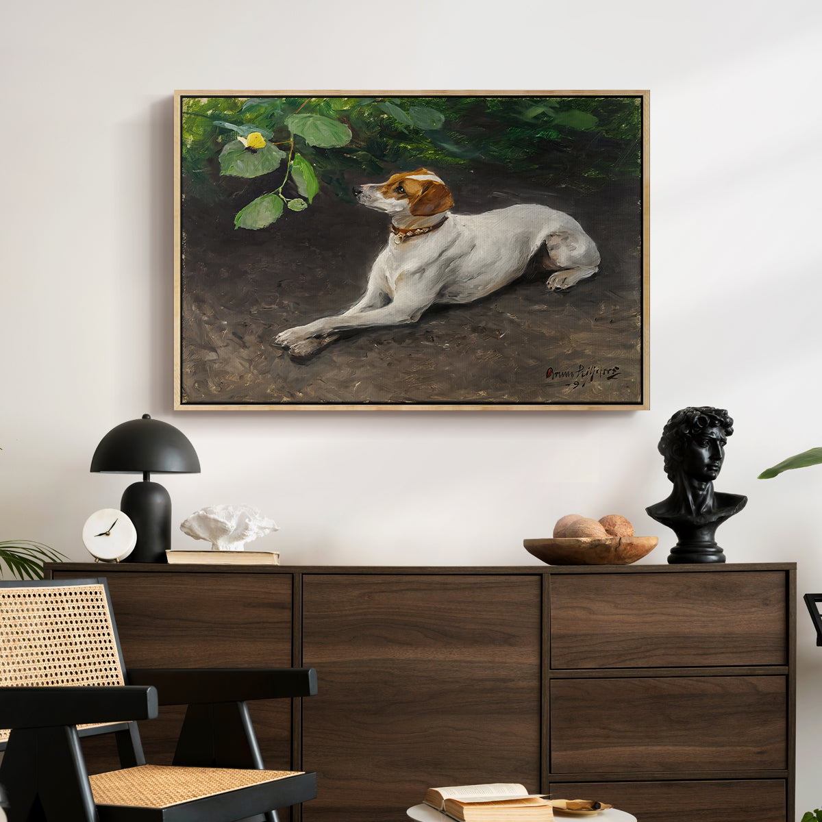 Portrait of a Dog, 1891 by Bruno Liljefors displayed in a natural wood floater framed canvas above a dark wood credenza in an entryway.