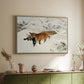 Natural wood floater framed canvas of Fox in Snow Landscape, 1900 by Bruno Liljefors, featuring a wildlife scene of fox moving swiftly through winter terrain above a sideboard in a softly lit hallway.
