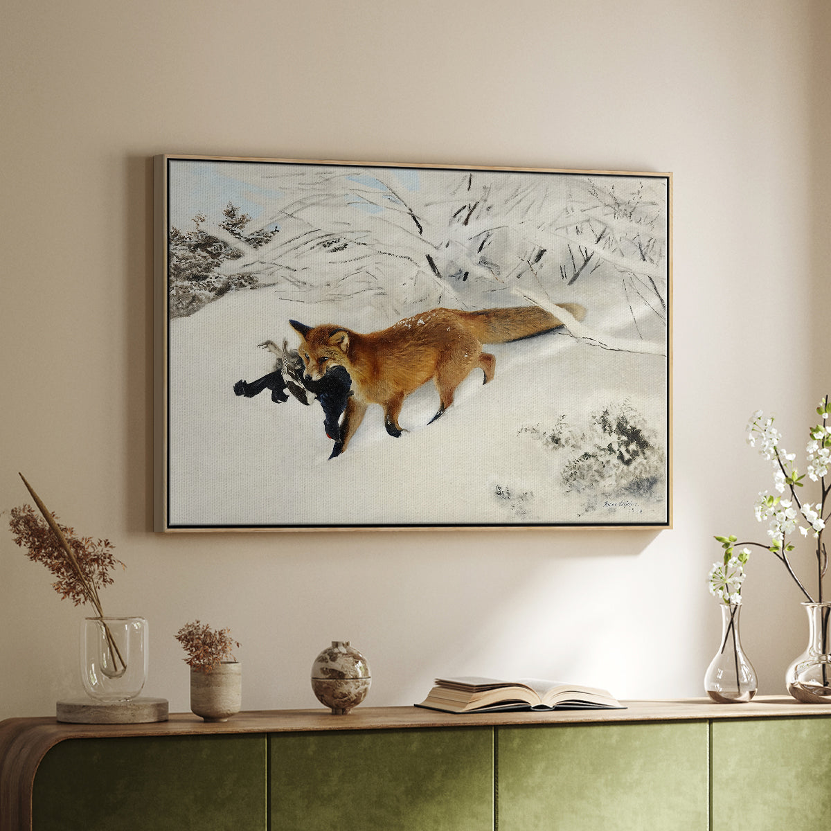 Natural wood floater framed canvas of Fox in Snow Landscape, 1900 by Bruno Liljefors, featuring a wildlife scene of fox moving swiftly through winter terrain above a sideboard in a softly lit hallway.