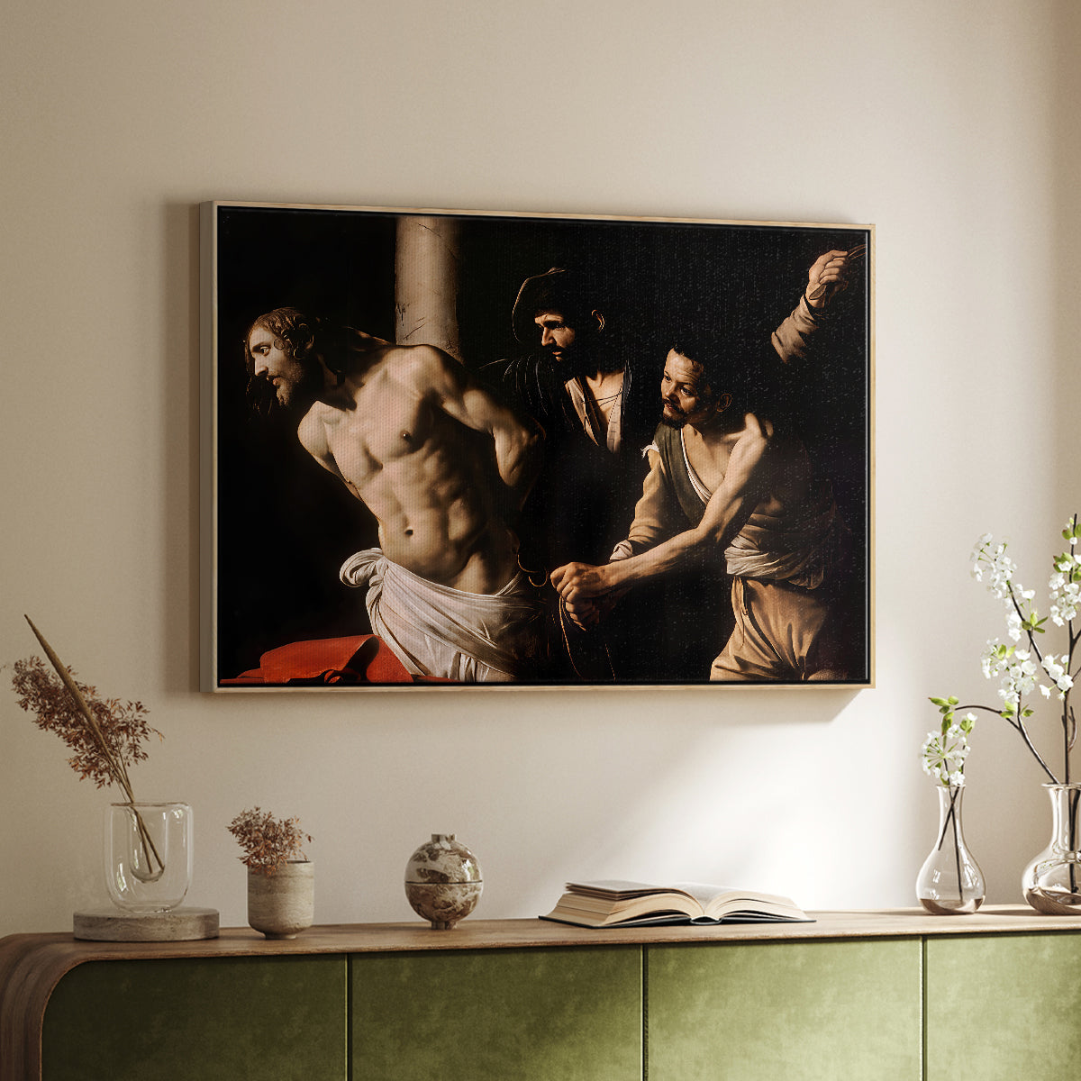 Natural wood floater framed canvas of The Flagellation of Christ at the Column (Rouen Version), 1606 by Caravaggio, featuring a dramatic religious scene of Christ enduring flagellation in dark interior above a sideboard in a softly lit hallway.