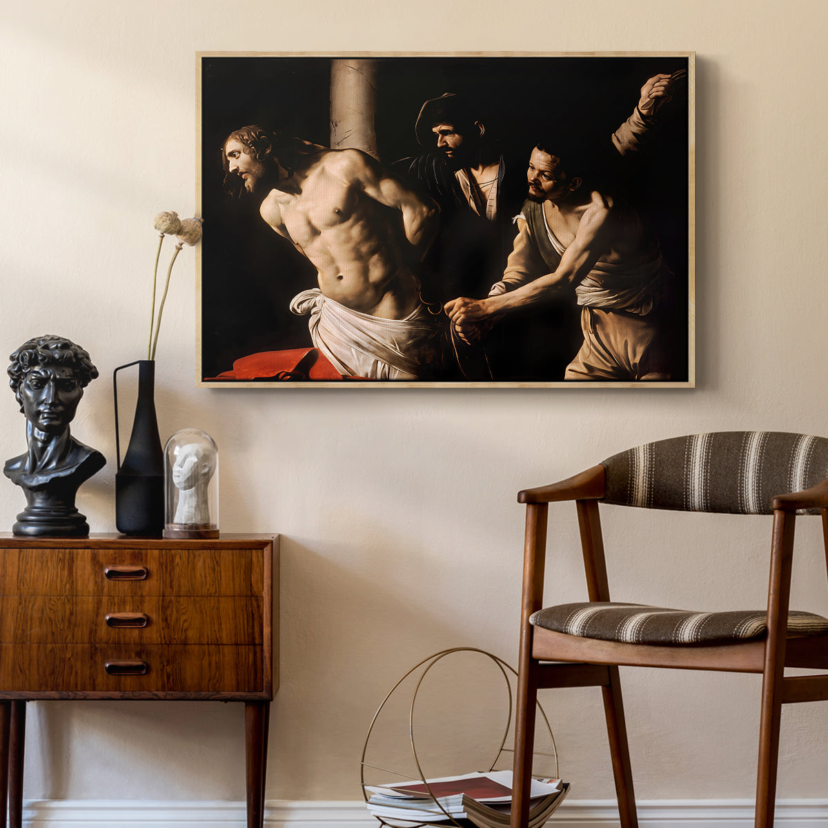 The Flagellation of Christ at the Column (Rouen Version), 1606 by Caravaggio as a natural wood floater framed canvas featuring a biblical depiction of men whipping Christ tied to pillar, styled above a mid-century console in a contemporary living area.