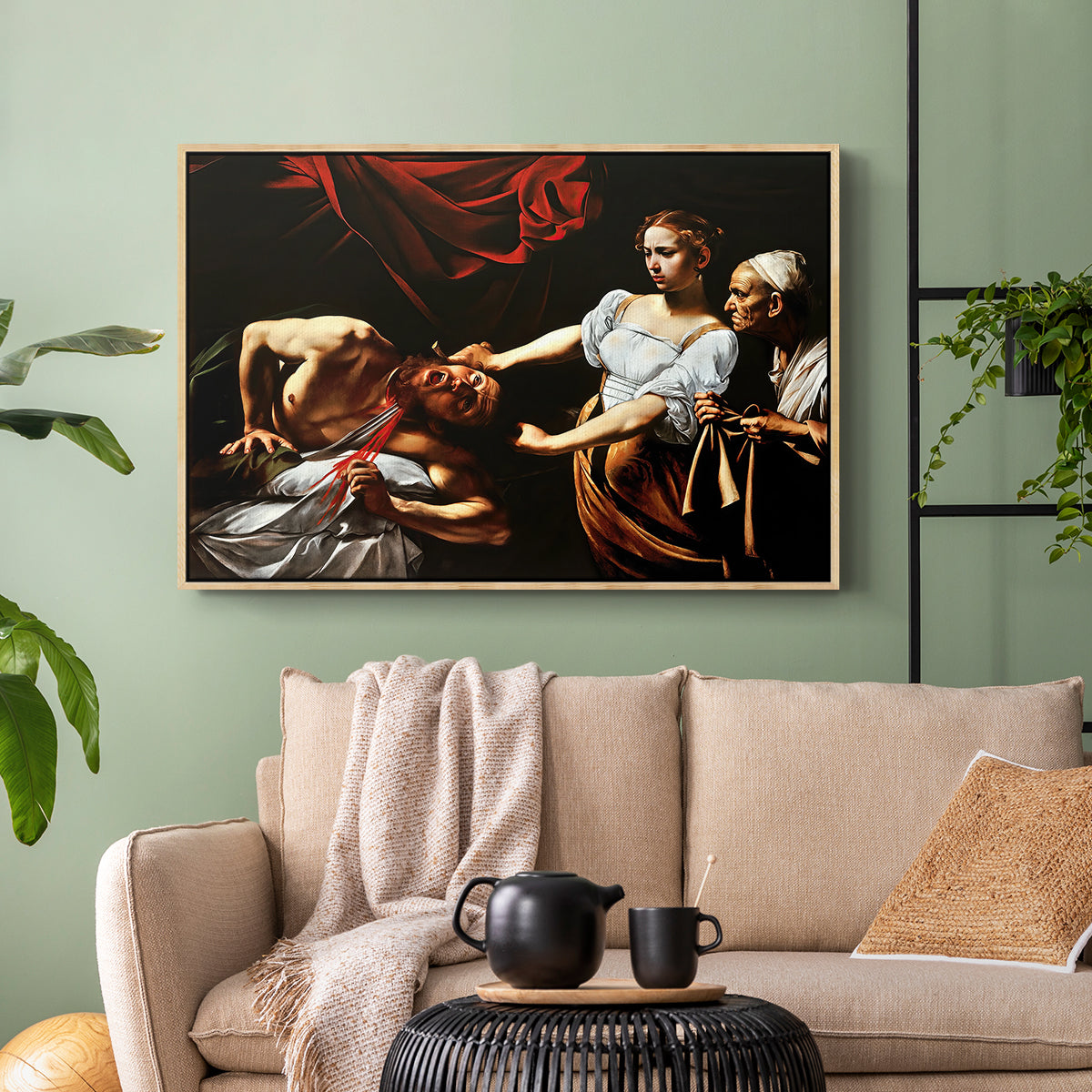 Natural wood floater framed canvas featuring a violent religious narrative with strong contrast of light and shadow, displayed above a sofa in a modern living room.
