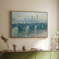 Natural wood floater framed canvas of Waterloo Bridge, Gray Weather, 1900 by Claude Monet, featuring an impressionist cityscape with bridge fading into fog over water above a sideboard in a softly lit hallway.