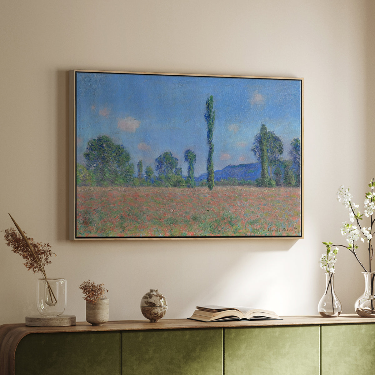 Natural wood floater framed canvas of Poppy Field (Giverny), 1890-1891 by Claude Monet, featuring an impressionist landscape of blooming poppies in countryside above a sideboard in a softly lit hallway.
