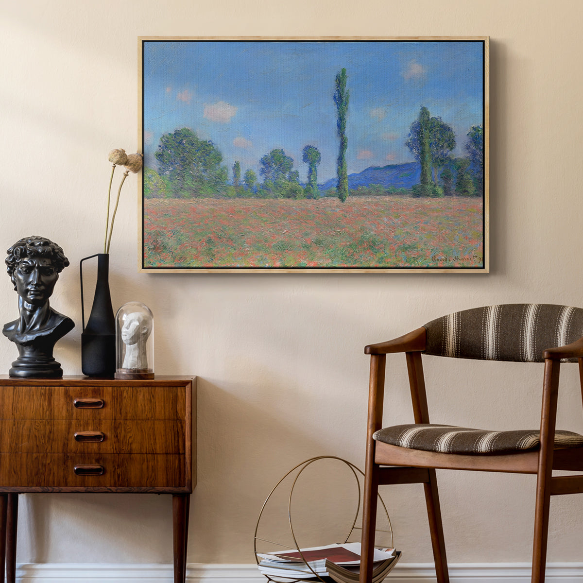 Poppy Field (Giverny), 1890-1891 by Claude Monet as a natural wood floater framed canvas featuring a vibrant meadow scene with flowers and vertical tree forms, styled above a mid-century console in a contemporary living area.