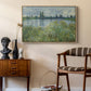 Banks of the Seine, Vétheuil, 1880 by Claude Monet as a natural wood floater framed canvas featuring a tranquil riverside scene with houses and vegetation, styled above a mid-century console in a contemporary living area.