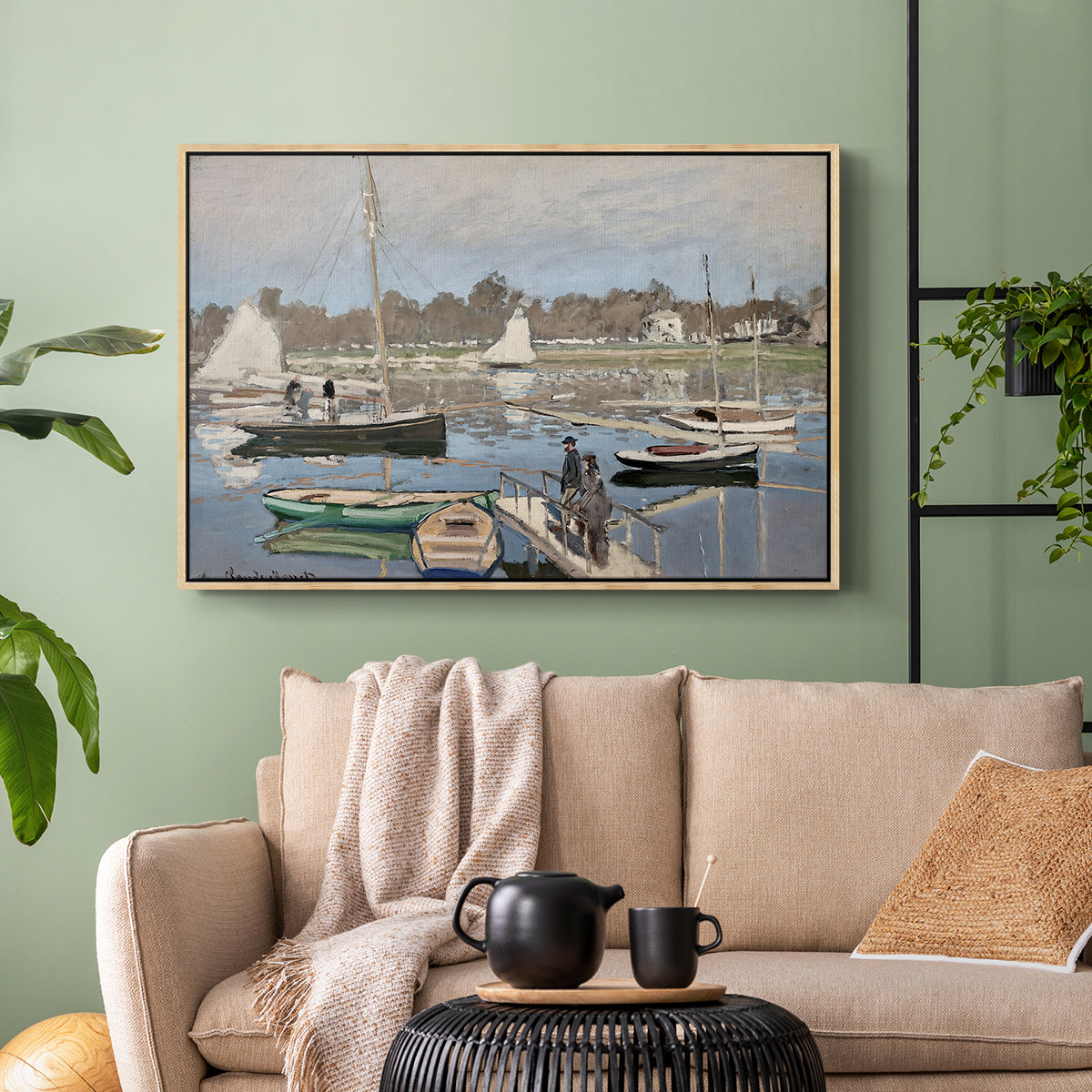 Natural wood floater framed canvas featuring a tranquil river setting with sailboats and shoreline, displayed above a sofa in a modern living room.