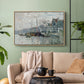 Natural wood floater framed canvas featuring a harbor view with masts, houses, and reflections in water, displayed above a sofa in a modern living room.
