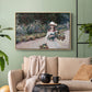 Natural wood floater framed canvas featuring a tranquil outdoor portrait of girl in floral setting, displayed above a sofa in a modern living room.