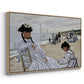 Angled view of On the Beach at Trouville, 1870 by Claude Monet in a natural wood floater framed canvas.