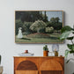 Woman in the Garden, Sainte-Adresse, 1867 by Claude Monet in a natural wood floater framed canvas featuring a woman standing in garden surrounded by flowers and greenery, displayed above a wood console cabinet.