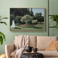 Natural wood floater framed canvas featuring a tranquil garden portrait with soft natural light, displayed above a sofa in a modern living room.