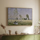 Natural wood floater framed canvas of Summer (L'ete), 1874 by Claude Monet, featuring an impressionist countryside scene with figure resting in shade above a sideboard in a softly lit hallway.
