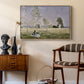 Summer (L'ete), 1874 by Claude Monet as a natural wood floater framed canvas featuring a sunlit meadow with woman surrounded by greenery, styled above a mid-century console in a contemporary living area.