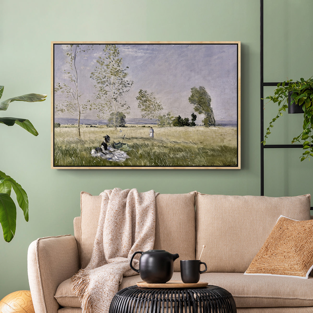 Natural wood floater framed canvas featuring a tranquil summer landscape with lone figure in nature, displayed above a sofa in a modern living room.