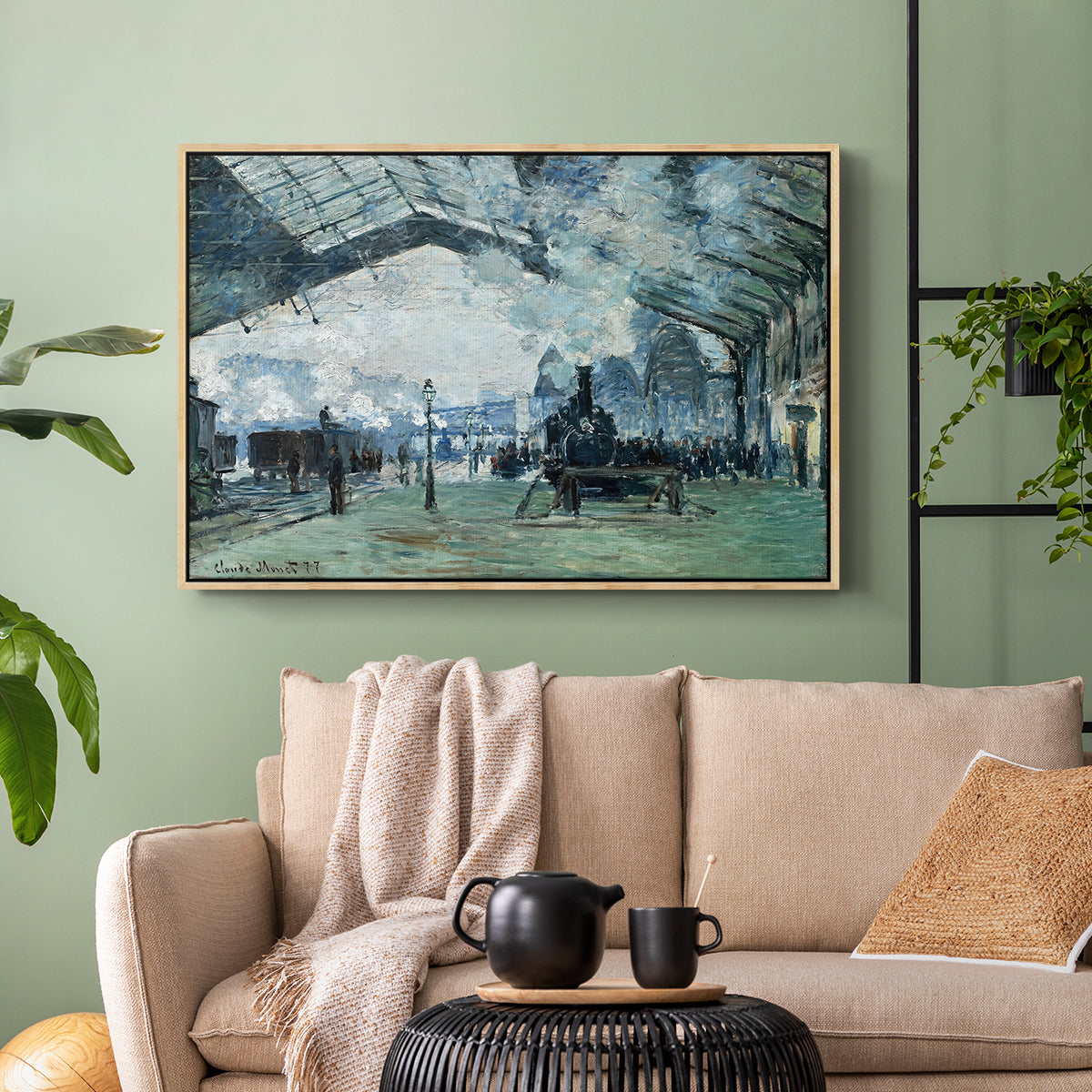 Natural wood floater framed canvas featuring a dramatic depiction of industrial space with trains and light, displayed above a sofa in a modern living room.