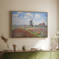 Natural wood floater framed canvas of Tulip Fields with the Rijnsburg Windmill, 1886 by Claude Monet, featuring a vibrant agricultural landscape with flowers and windmill above a sideboard in a softly lit hallway.