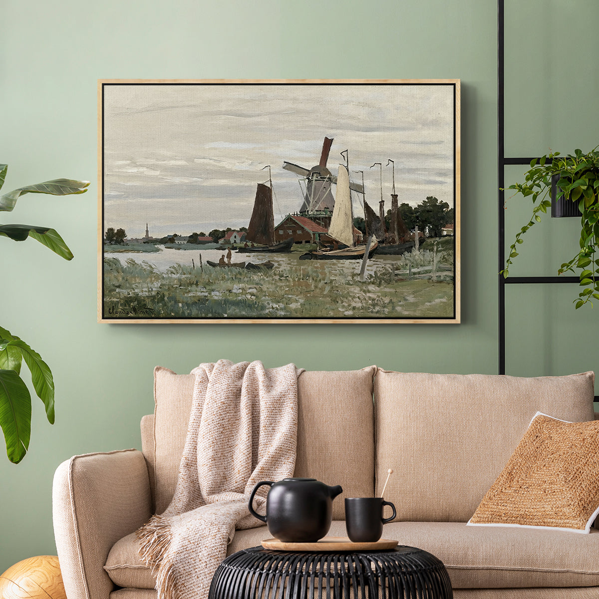 Natural wood floater framed canvas featuring a countryside structure standing against open sky, displayed above a sofa in a modern living room.