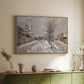 Natural wood floater framed canvas of The Boulevard de Pontoise at Argenteuil, Snow Effect, 1875 by Claude Monet, featuring an impressionist winter scene with road and bare trees above a sideboard in a softly lit hallway.