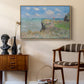 The Cliff Walk at Pourville, 1882 by Claude Monet as a natural wood floater framed canvas featuring a coastal cliff scene with grass, wind, and expansive sea view, styled above a mid-century console in a contemporary living area.