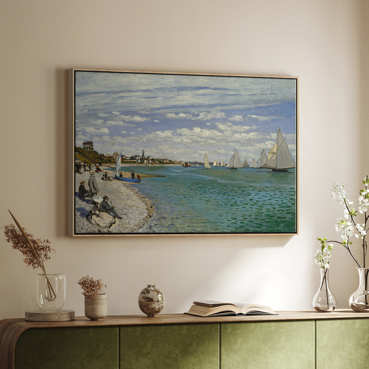 Natural wood floater framed canvas of Regatta at Sainte-Adresse, 1867 by Claude Monet, featuring a lively regatta scene with boats and people on beach above a sideboard in a softly lit hallway.