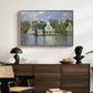 Houses on the Zaan River at Zaandam, 1871 by Claude Monet displayed in a natural wood floater framed canvas above a dark wood credenza in an entryway.