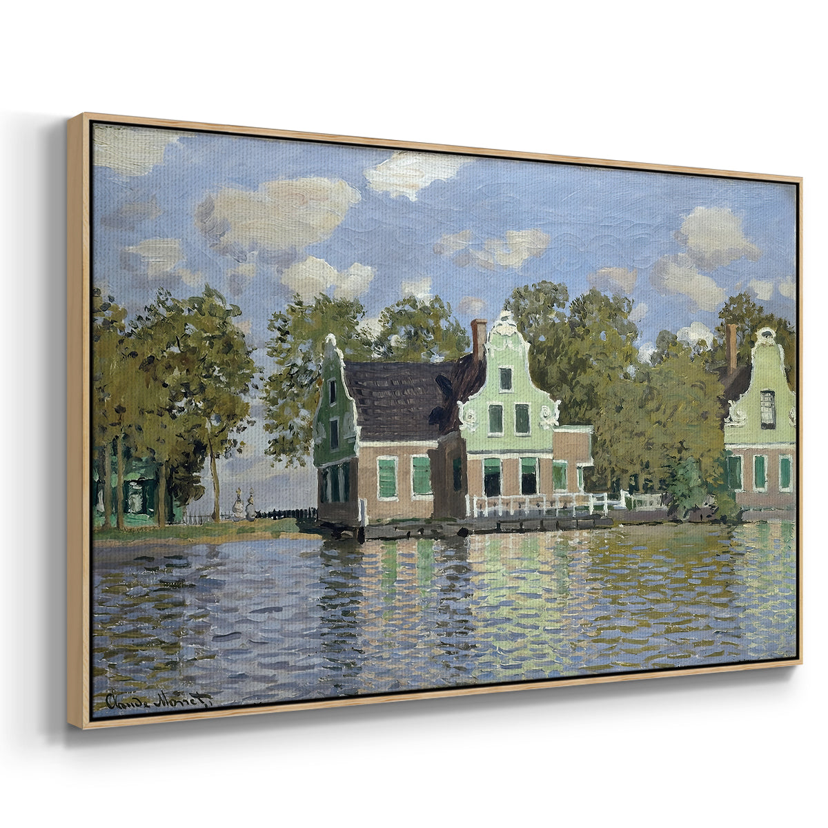 Angled view of Houses on the Zaan River at Zaandam, 1871 by Claude Monet in a natural wood floater framed canvas.