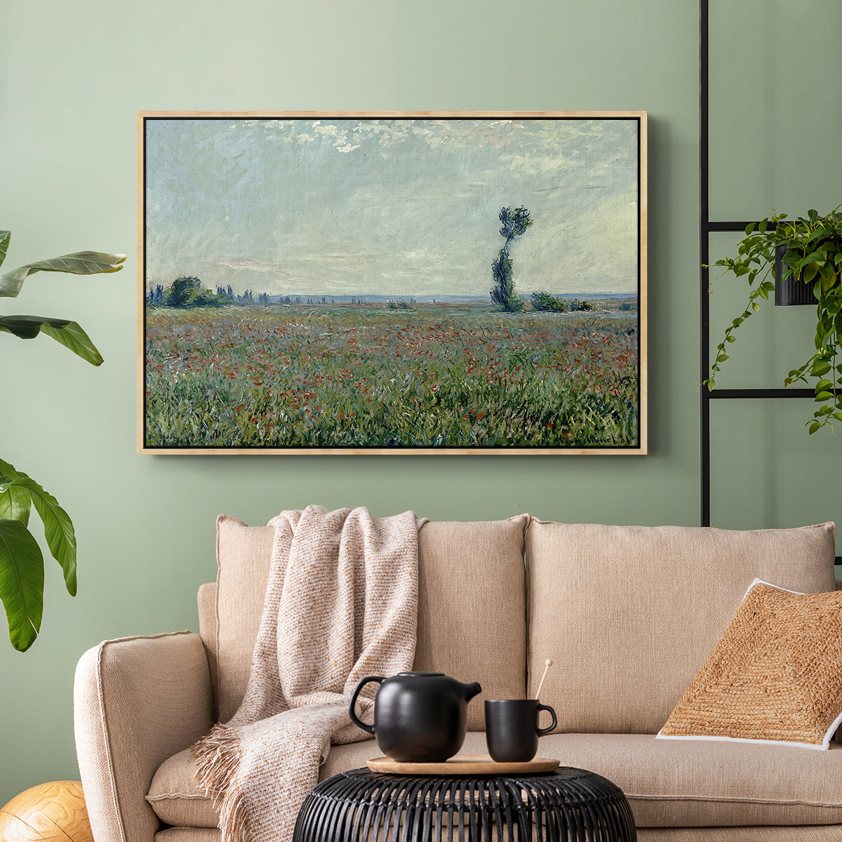 Natural wood floater framed canvas featuring a natural field scene with vibrant red flowers, displayed above a sofa in a modern living room.
