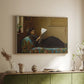 Natural wood floater framed canvas of Interesting News, 1872 by Eastman Johnson, featuring a domestic scene with figures reacting to shared news above a sideboard in a softly lit hallway.
