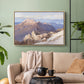 Natural wood floater framed canvas featuring an expansive mountainous landscape with natural depth, displayed above a sofa in a modern living room.